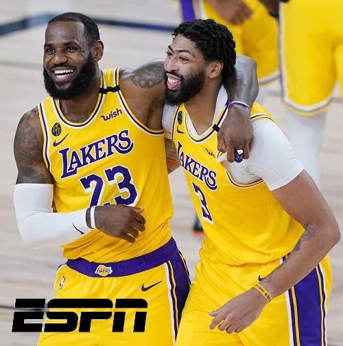 Los Angeles Lakers' LeBron James (23) and Anthony Davis (3) celebrate after defeating the Denver Nuggets 124-121 during an NBA basketball game Monday, Aug. 10, 2020, in Lake Buena Vista, Fla. (AP Photo/Ashley Landis, Pool)